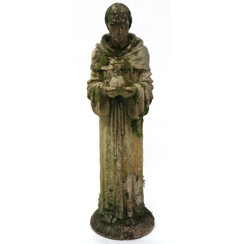 2068 - A 20TH CENTURY STONEWARE STATUE OF ST. FRANCISwith the robed figure clutching a dove, 91cm high... 