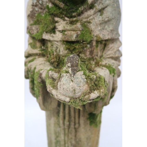 2068 - A 20TH CENTURY STONEWARE STATUE OF ST. FRANCISwith the robed figure clutching a dove, 91cm high... 