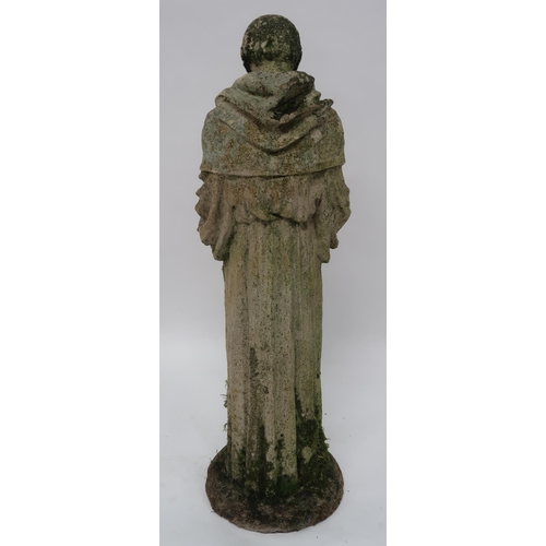 2068 - A 20TH CENTURY STONEWARE STATUE OF ST. FRANCISwith the robed figure clutching a dove, 91cm high... 