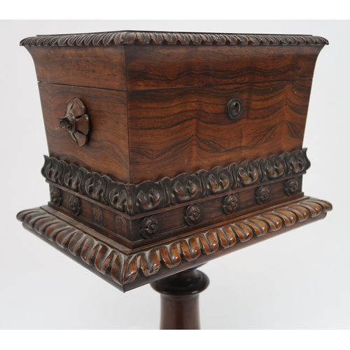 2069 - A VICTORIAN ROSEWOOD TEAPOYwith sarcophagus moulded hinged top caddy on turned pedestal on quatrefoi... 