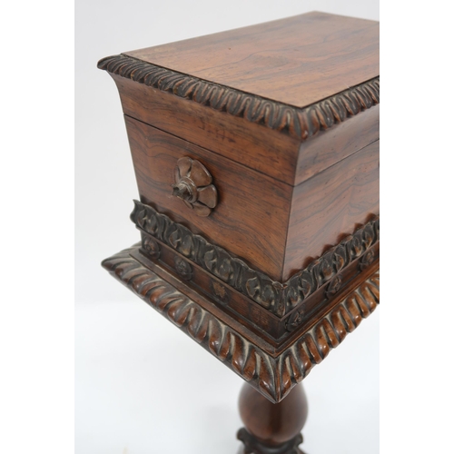 2069 - A VICTORIAN ROSEWOOD TEAPOYwith sarcophagus moulded hinged top caddy on turned pedestal on quatrefoi... 