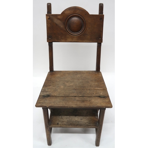 2070 - AN EARLY 20TH CENTURY OAK ARTS AND CRAFTS METAMORPHIC LIBRARY CHAIRwith plain splat carved with rond... 