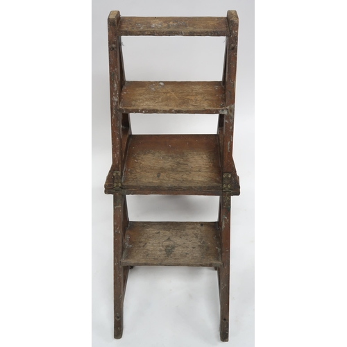 2070 - AN EARLY 20TH CENTURY OAK ARTS AND CRAFTS METAMORPHIC LIBRARY CHAIRwith plain splat carved with rond... 