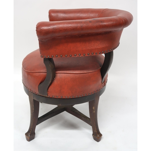 2071 - A LATE VICTORIAN MAHOGANY FRAMED SWIVEL CAPTAINS CHAIRwith red rexine upholstery on stretchered outs... 