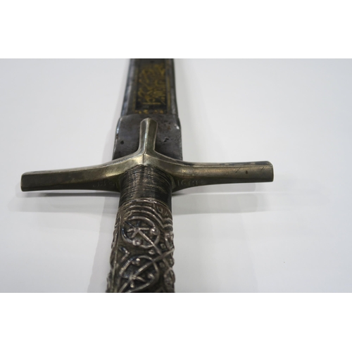 2667 - A NORTHEAST AFRICAN KASKARA SWORDThe Damascene blade inlaid with yellow metal Arabic script along it... 