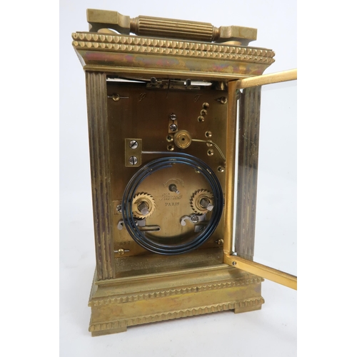 2220 - A FRENCH BRASS AND GLASS REPEATING CARRIAGE CLOCKthe gilded face with applied column and arch decora... 