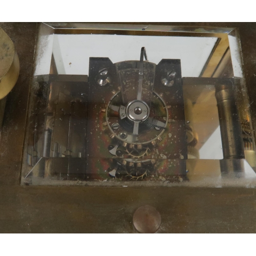 2220 - A FRENCH BRASS AND GLASS REPEATING CARRIAGE CLOCKthe gilded face with applied column and arch decora... 