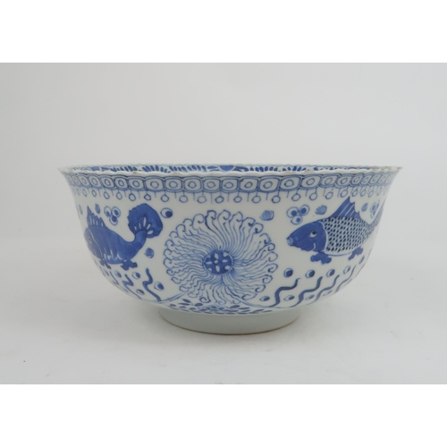 2427 - A CHINESE BLUE AND WHITE BOWL Painted with fish and aquatic foliage, four character reign marks, 23.... 