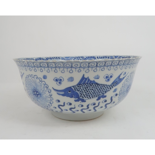 2427 - A CHINESE BLUE AND WHITE BOWL Painted with fish and aquatic foliage, four character reign marks, 23.... 