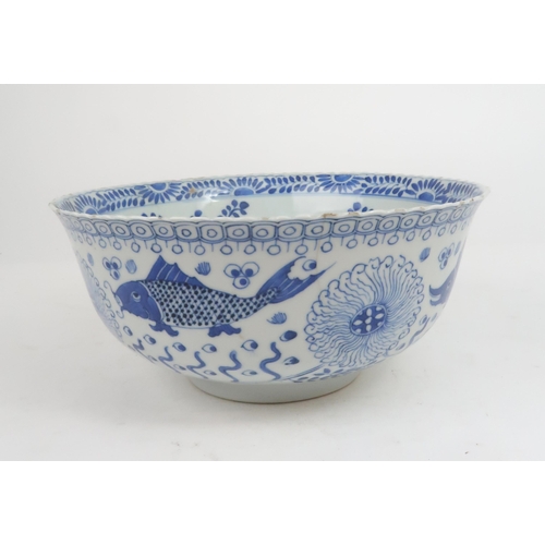 2427 - A CHINESE BLUE AND WHITE BOWL Painted with fish and aquatic foliage, four character reign marks, 23.... 