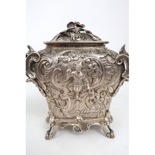 2497 - A PAIR OF WILLIAM IV SILVER CHINOSERIE TEA CADDIESof bombe form, profusely chased with rococo scroll... 