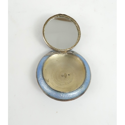 2500 - A RUSSIAN SILVER GUILLOCHE ENAMEL COMPACTof circular form, with cornflower blue enamel decoration, t... 