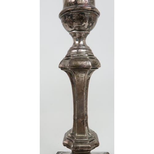 2502 - A PAIR OF EDWARDIAN SILVER CANDLESTICKSthe faceted knopped stem supported on a further capstan stem,... 