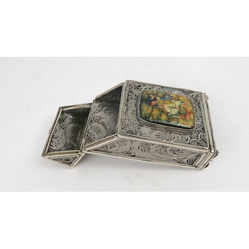 2503 - A RUSSIAN SILVER AND PAPIER-MÂCHÉ CIGARETTE CASEof rectangular form, the body of fine filigree work,... 