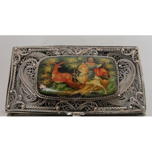 2503 - A RUSSIAN SILVER AND PAPIER-MÂCHÉ CIGARETTE CASEof rectangular form, the body of fine filigree work,... 