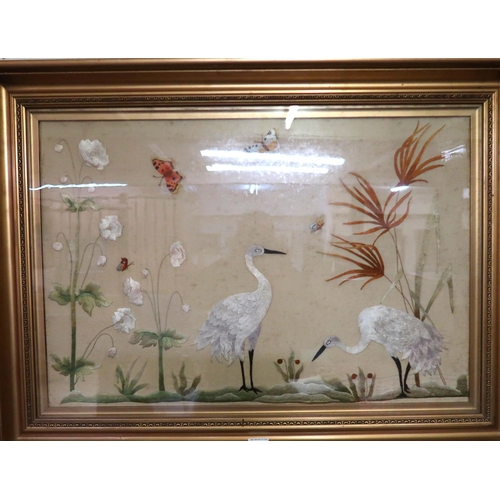 101 - A framed tapestry depicting birds