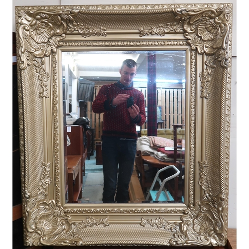 105 - A 20th century gilt framed bevelled glass wall mirror and a gilt framed oil on canvas signed Jocabs ... 