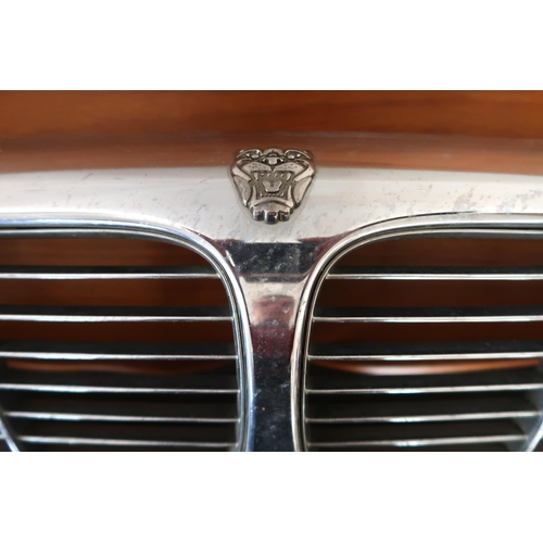 116 - A 20th century chrome coloured Jaguar radiator grill, 23cm high x 87cm wide