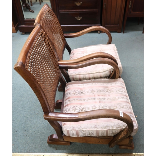 118 - A pair of early 20th century mahogany framed bergere armchairs with rocking bases, 86cm high x 56cm ... 