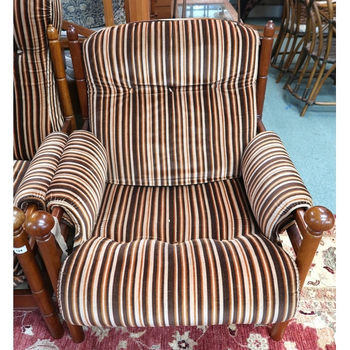 124 - A mid 20th century teak framed Guy Rogers three piece suite consisting three seater settee, 83cm hig... 