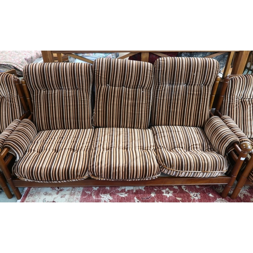 124 - A mid 20th century teak framed Guy Rogers three piece suite consisting three seater settee, 83cm hig... 