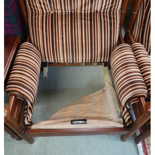 124 - A mid 20th century teak framed Guy Rogers three piece suite consisting three seater settee, 83cm hig... 