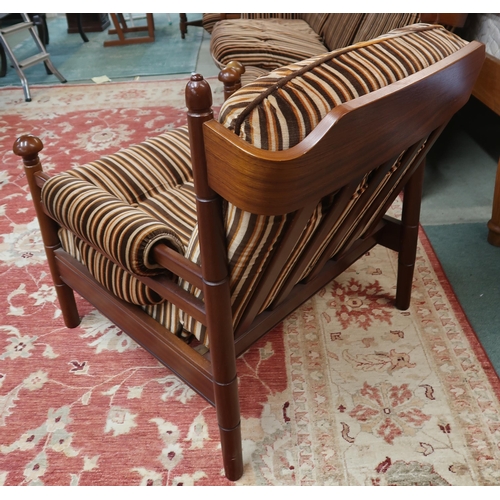 124 - A mid 20th century teak framed Guy Rogers three piece suite consisting three seater settee, 83cm hig... 