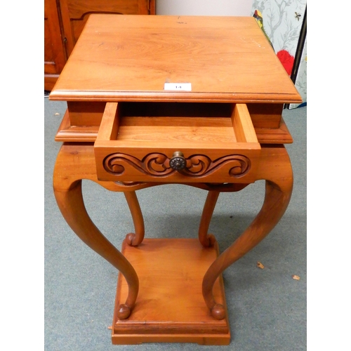 14 - A contemporary square topped single drawer jardinière stand with carved fretwork friezes over cabrio... 