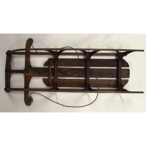 34 - A 20th century beech and iron child's sled, 115cm long x 58cm wide x 19cm high