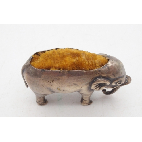 403 - A novelty silver pin cushion, modelled as an elephant, Birmingham, marks rubbed, 9gms