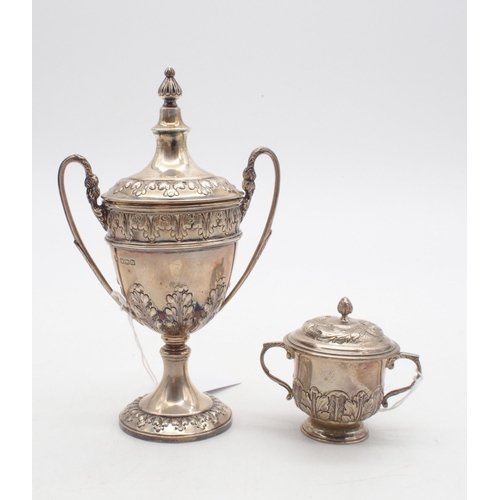 408 - A silver miniature trophy cup and cover, the body with repousse acanthus leaf decoration, with a kno... 