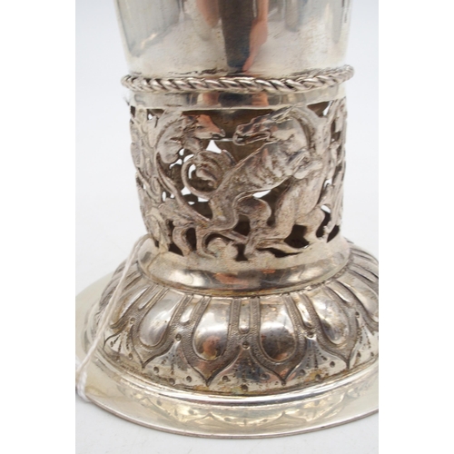 410 - A German silver trumpet vase, the body hammered, with a band of scrolling openwork, the circular bas... 