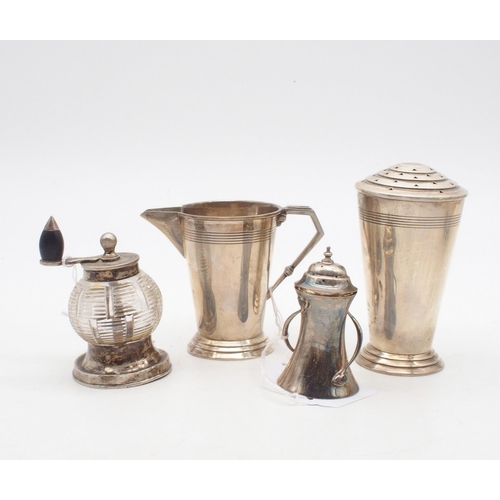 415 - A collection of silver including an Art Deco silver cream jug and caster, on stepped circular bases,... 