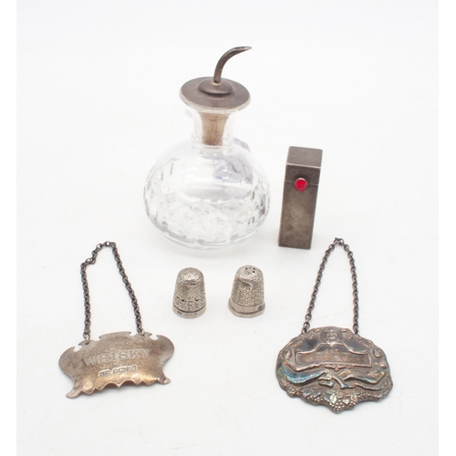 417 - A collection of silver including a silver topped cut glass oil decanter, by Barker Brothers, a heavy... 