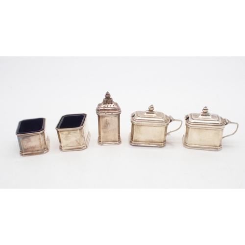 428 - A five piece silver condiment set, of canted form, with blue glass liners, by Goldsmiths & Silve... 