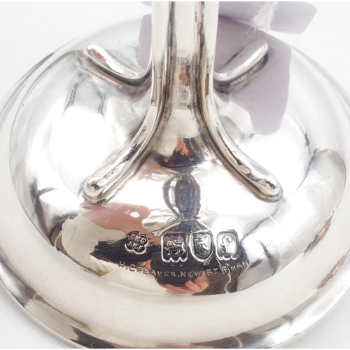 430 - An Edwardian silver Arts and Crafts style vase, of stylised form with a slightly flaring rim, on a d... 