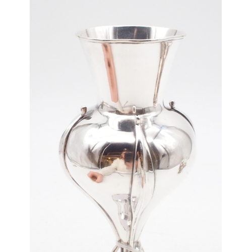 430 - An Edwardian silver Arts and Crafts style vase, of stylised form with a slightly flaring rim, on a d... 