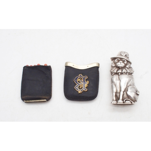 431 - A Novelty stamped silver Toby Punch and Judy vesta case, 6cm, c. 1890's, together with a white metal... 