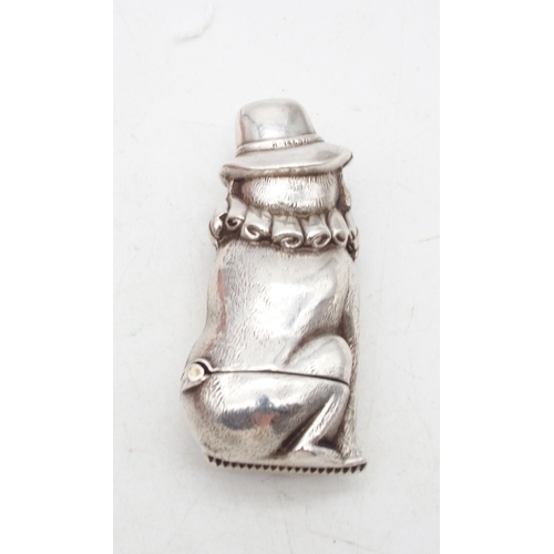 431 - A Novelty stamped silver Toby Punch and Judy vesta case, 6cm, c. 1890's, together with a white metal... 