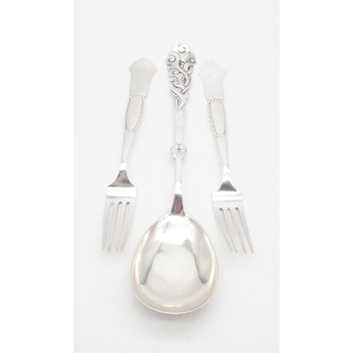 432 - A collection of Danish silver including a pair of forks, the terminals with a hammered finish, by J.... 