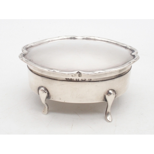 433 - An Edwardian silver jewellery box, of shaped form, on four pad feet, by T H Hazelwood & Co, Birm... 