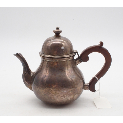 436 - A George VI silver teapot, of baluster form, with a bell finial and a wooden handle and thumbpiece, ... 