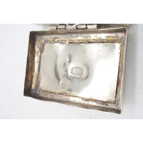 438 - A Chinese silver snuff box, the lid with pierced floral openwork, the base embossed with vine motifs... 