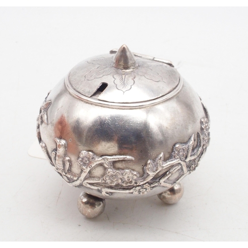 438 - A Chinese silver snuff box, the lid with pierced floral openwork, the base embossed with vine motifs... 