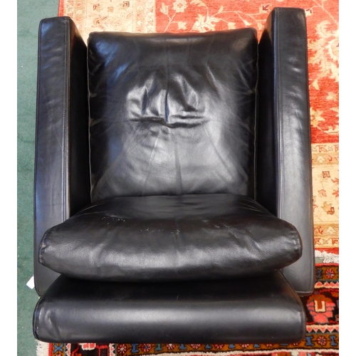 65 - A contemporary black leather upholstered Habitat open armchair on black square tapering feet, 77cm h... 