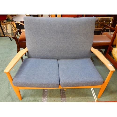 66 - A mid 20th century teak framed Parker Knoll two seater sofa with blue upholstery, 90cm high x 119cm ... 