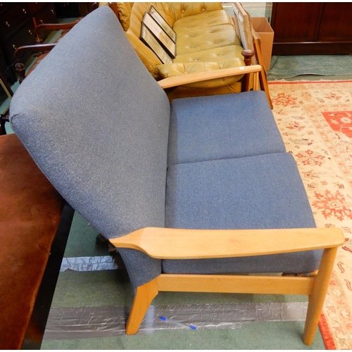 66 - A mid 20th century teak framed Parker Knoll two seater sofa with blue upholstery, 90cm high x 119cm ... 