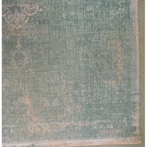 69 - A modern aqua ground Belgian Louis de Poortere rug with distressed Kashan design, 240cm long x 170cm... 