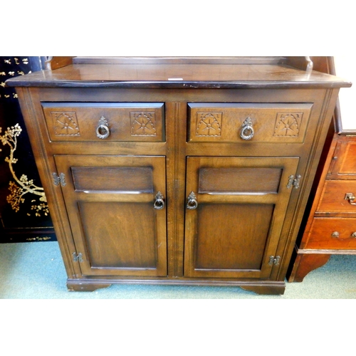 71 - A 20th century mahogany kitchen dresser with plate rack over two drawers over pair of cabinet doors,... 