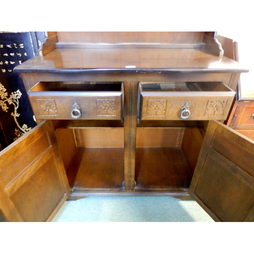 71 - A 20th century mahogany kitchen dresser with plate rack over two drawers over pair of cabinet doors,... 